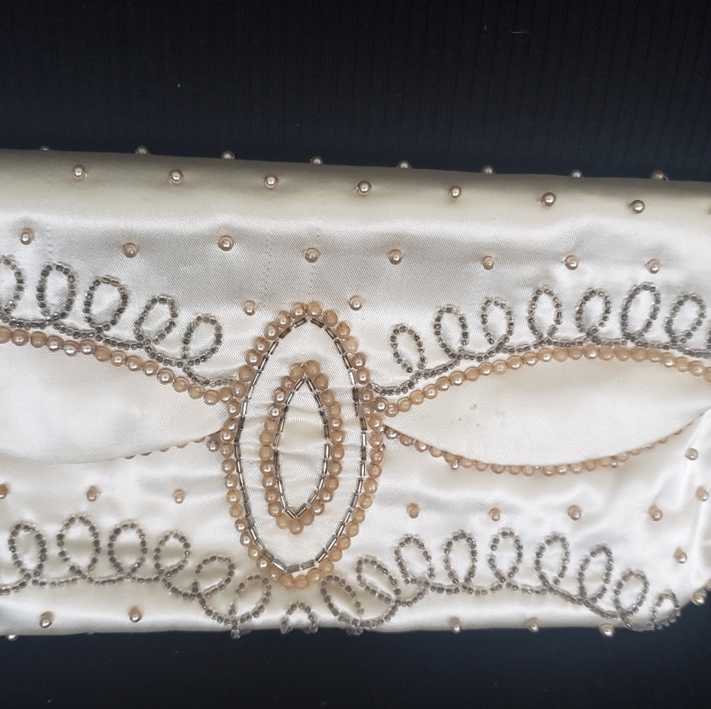 La Regal silk pearl clutch